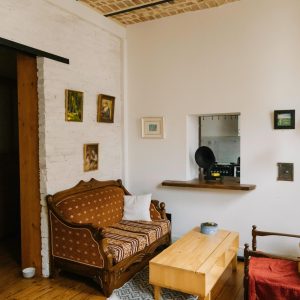 Charming vintage living room with rustic wood furniture and retro decor in Istanbul.